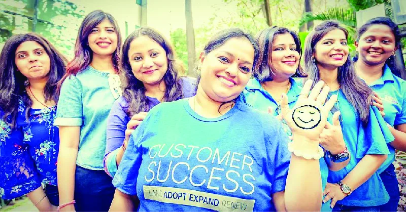 Figure 7.5 These Cisco employees, part of a newly formed Virtual Customer Success team in India, help promote the brand and perhaps promote change as well. Women have been underrepresented in STEM careers (science, technology, engineering, math), and this group takes pride in the fact that they are part of a gender-balanced team. This photo was submitted as part of the annual #WeAreCisco #LoveWhereYouWork contest, with the hashtag #womenintech and the photo caption “Sorry, we’re busy making a difference.” (credit: modification of work by Shojana Ravi/Cisco, CC BY 4.0, used with the permission of https://thenetwork.cisco.com)
