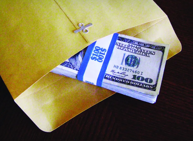 Figure 7.7“Under the table” and “off the books” are terms applied to payments that are really bribes. (credit: modification of “Graft for Everyone!” by Chris Potter/Flickr, CC BY 2.0)
