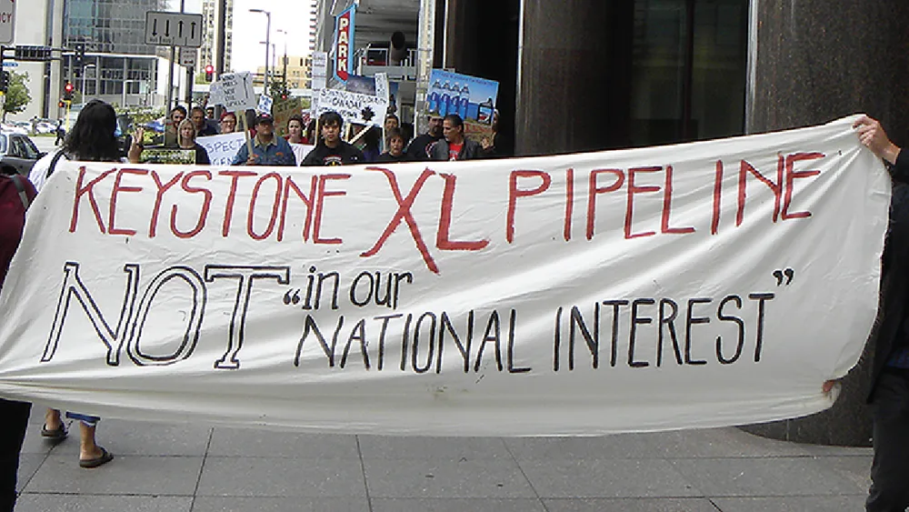 Figure 4.10 Groups across the political spectrum have come together to protest the proposed Keystone pipeline route. (credit: modification of “Protest against the proposed KeystoneXL tar sands pipeline” by Fibonacci Blue/Flickr, CC BY 2.0)