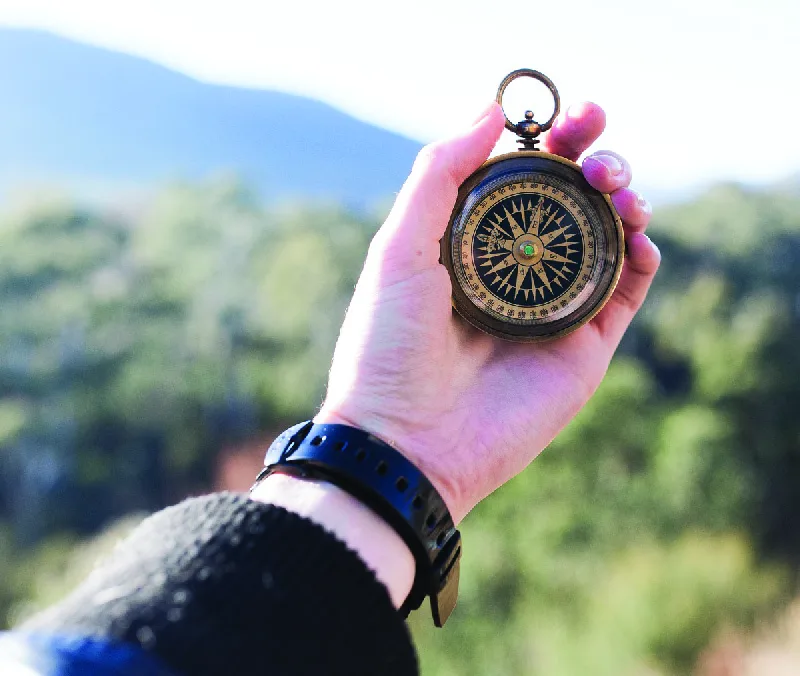 Figure 11.7 Professionals need to develop a personal mission statement to avoid straying from the path they have set for themselves. A personal mission statement can serve as an ethical compass, guiding an individual through his or her professional and personal life. (credit: modification of “adventure compass hand macro” by Unknown/Pixabay, CC0)