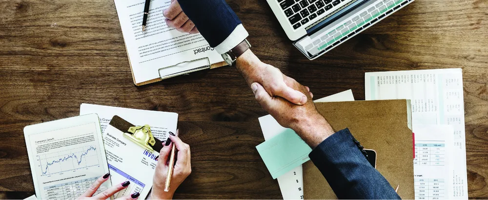Figure 1.1 Each of us makes innumerable decisions every day. In a business context, these choices have consequences for ourselves and others whom we must take into account in our decision-making process. (credit: modification of “business paper office laptop” by “rawpixel”/Pixabay, CC0)